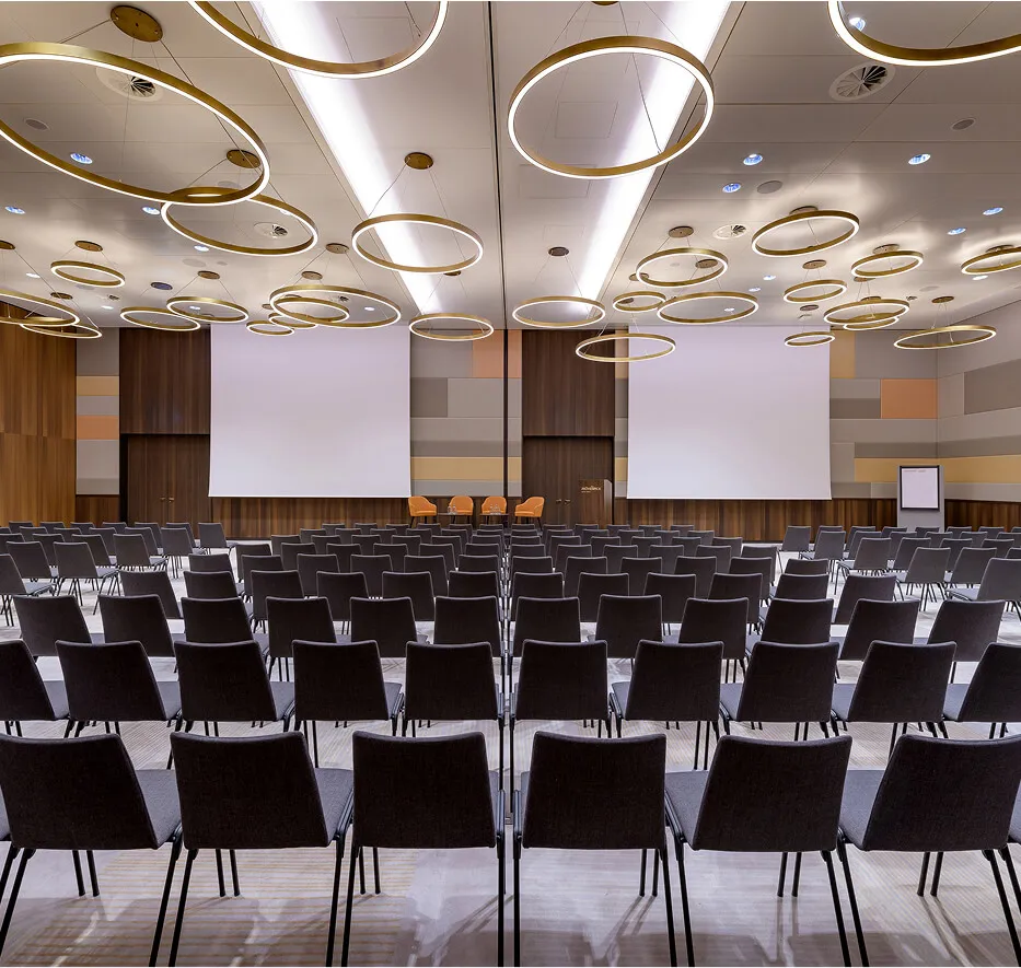 Great ballroom with chairs and round daylight lamps
