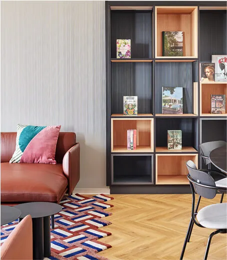 View on outside pool with sunbed in front and palm trees in the back