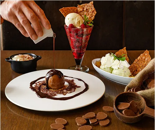 Wooden table with variety of desserts